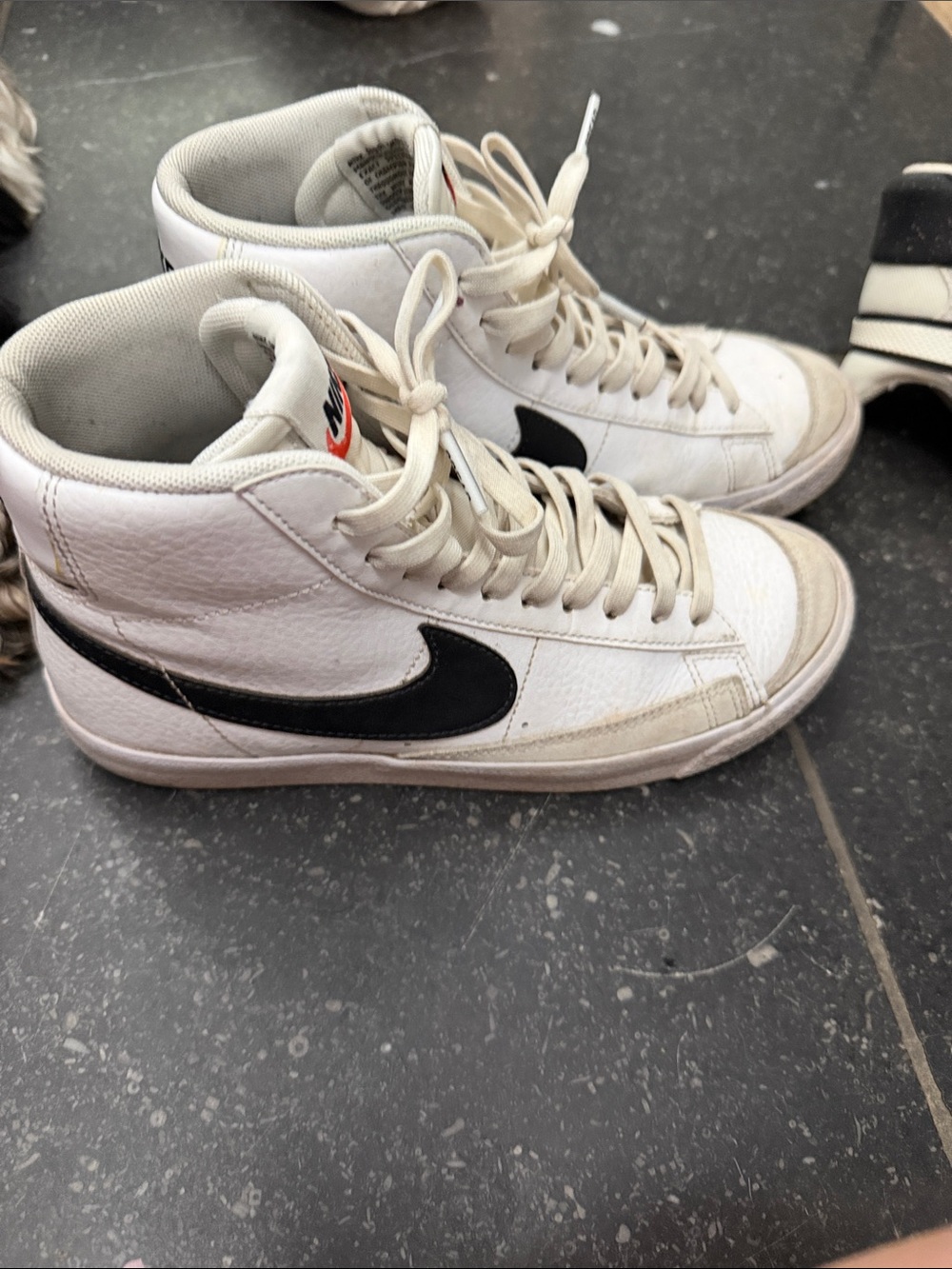 Nike White High-Top Sneakers with Black Swoosh